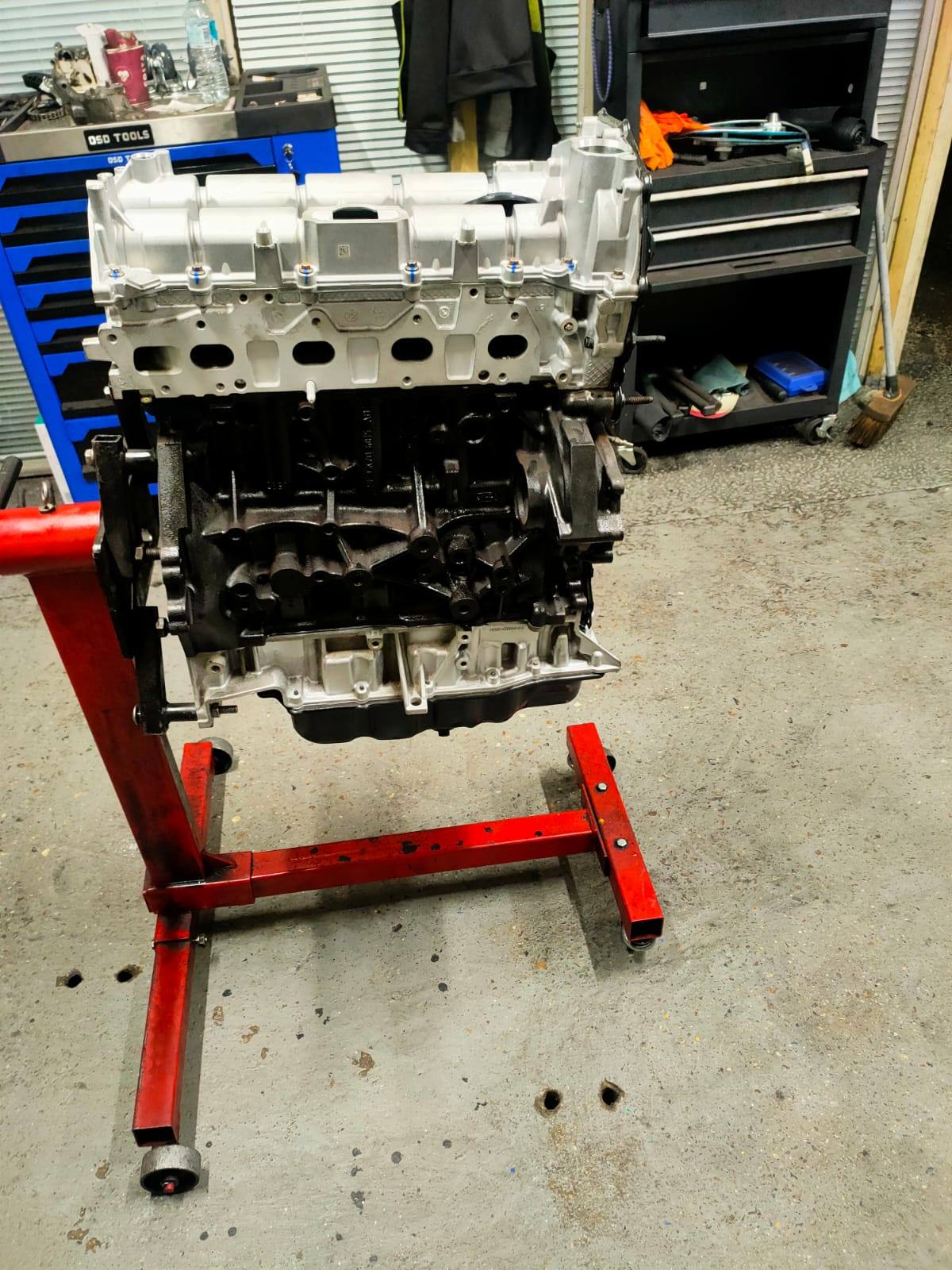 Reconditioned diesel van engine being rebuilt on the bench in the Swanscombe workshop